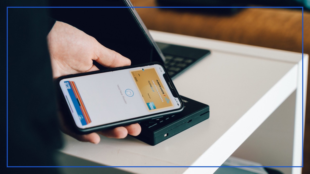 Customer is using mobile phone to pay for product with NFC
